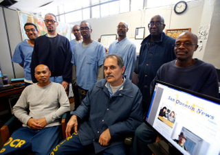 Arnulfo T. Garcia, center foreground, editor-in-chief of the San Quentin News, with his staff inside the newspaper offices in San Quentin State Prison in 2015. (Credit: Karl Mondon/Bay Area News Group) See third item.